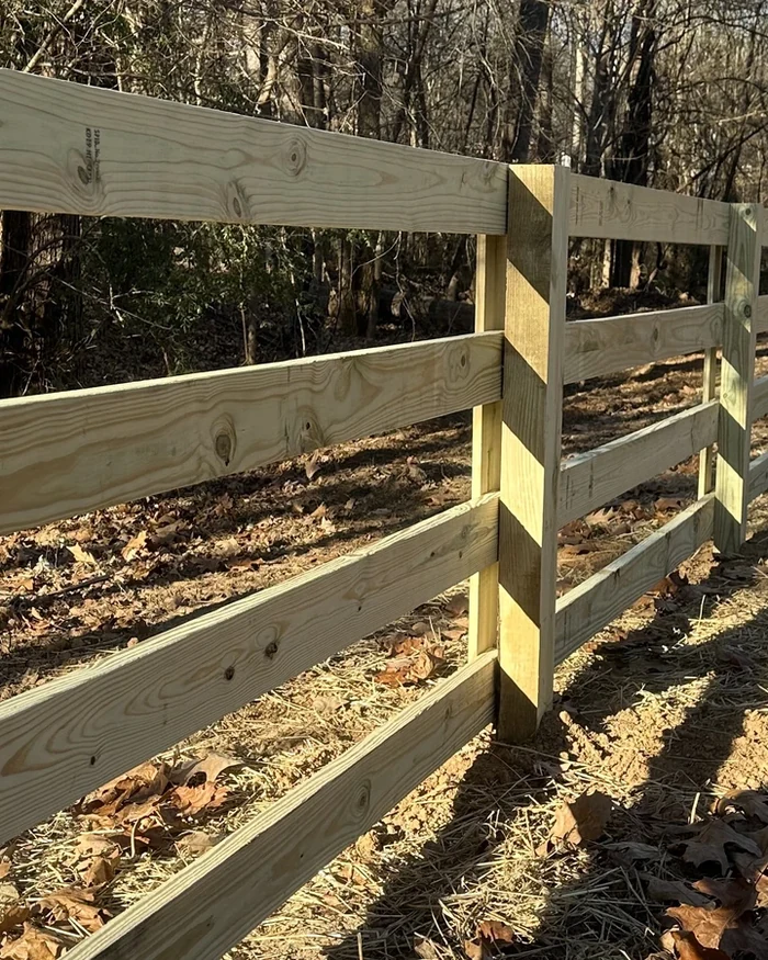 A white picket fence along a front walk with a matching gate